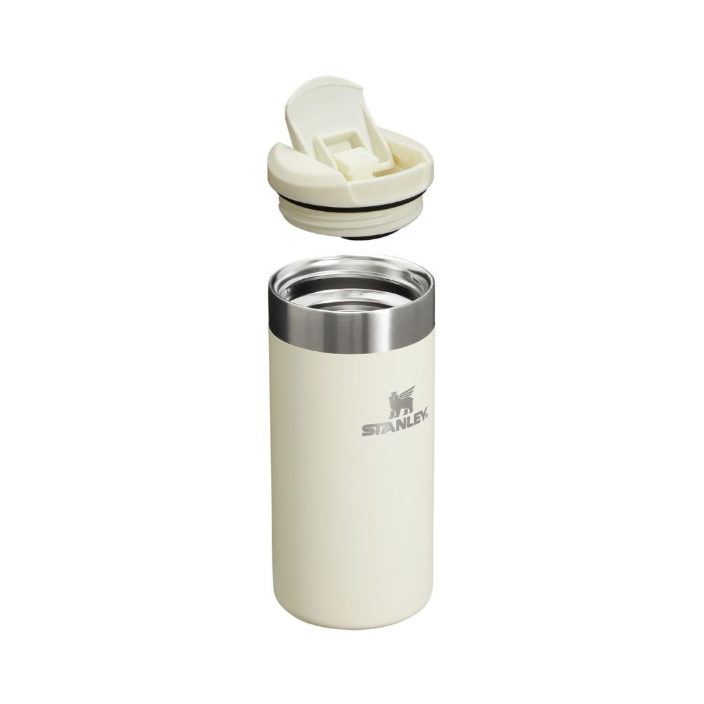 Stanley insulated tumbler with beige lid on a white background