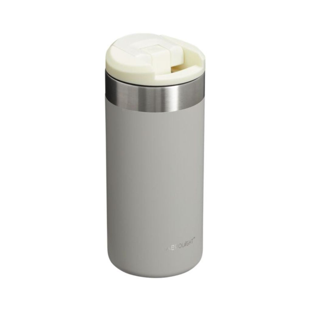 Gray insulated travel mug with a white lid on a white background