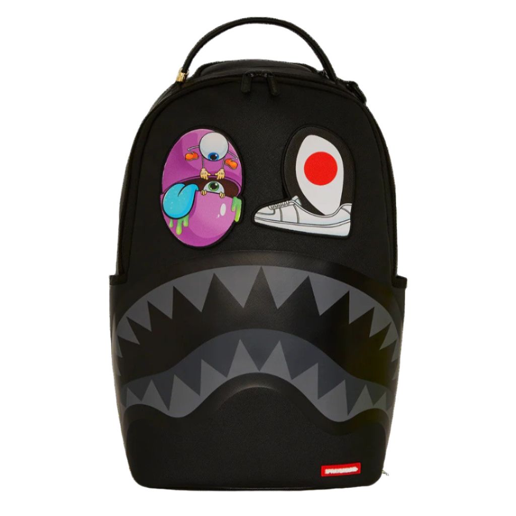 Black backpack with cartoon face design and visible brand logo on a white background