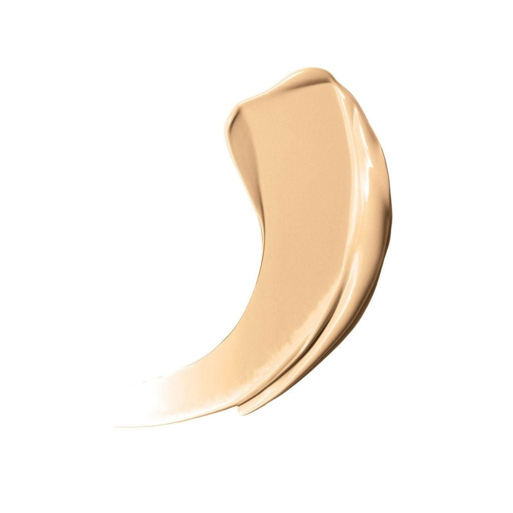 Beige cosmetic cream swatch on a white background