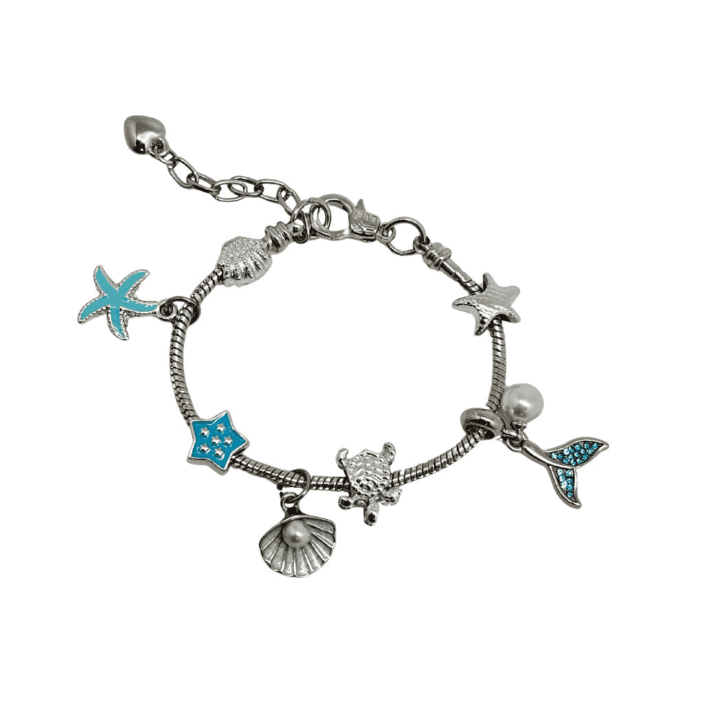 Silver bracelet with various charms including starfish, shells, and a turtle on a white background