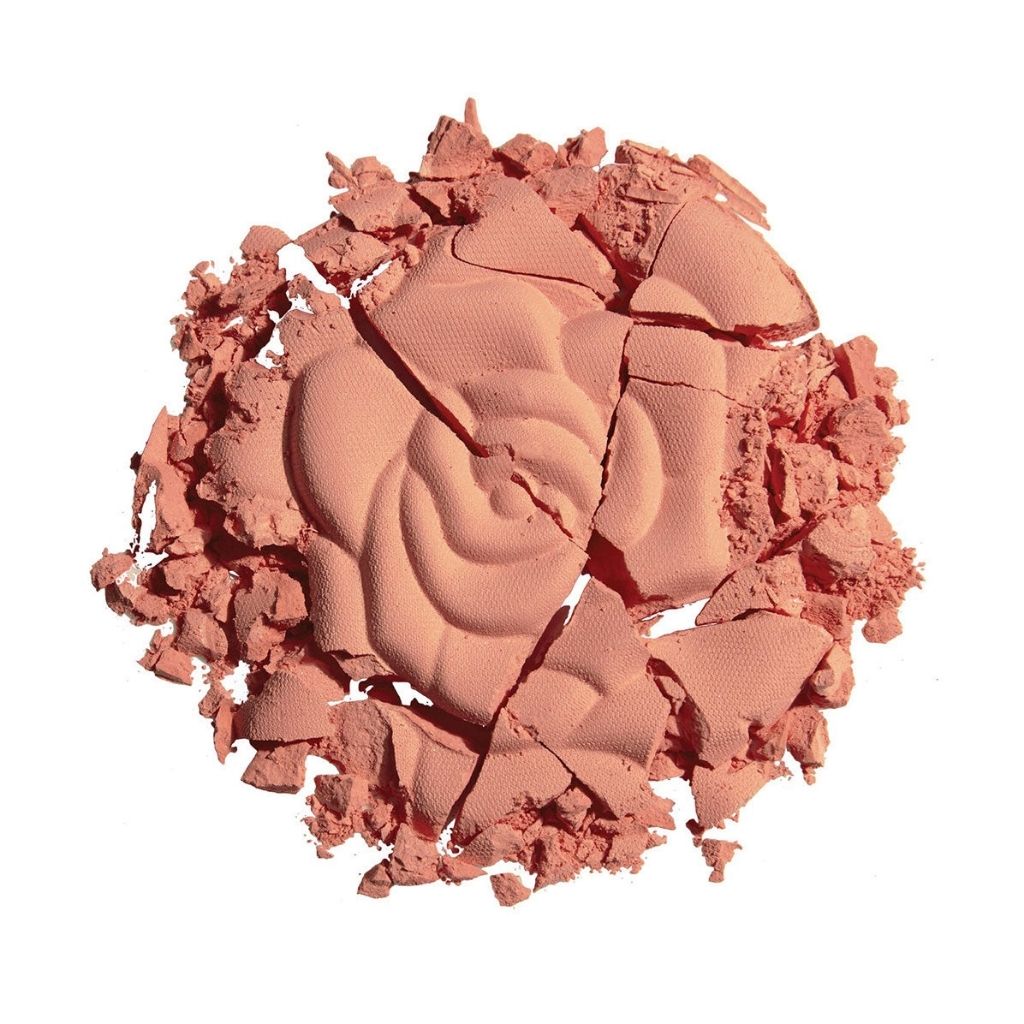 Crumbled blush compact with a swirled design on a white background