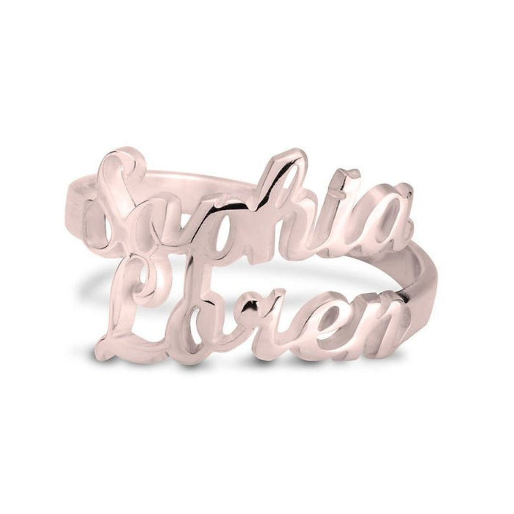 Rose gold ring with 'Sophia Loren' engraving on a white background