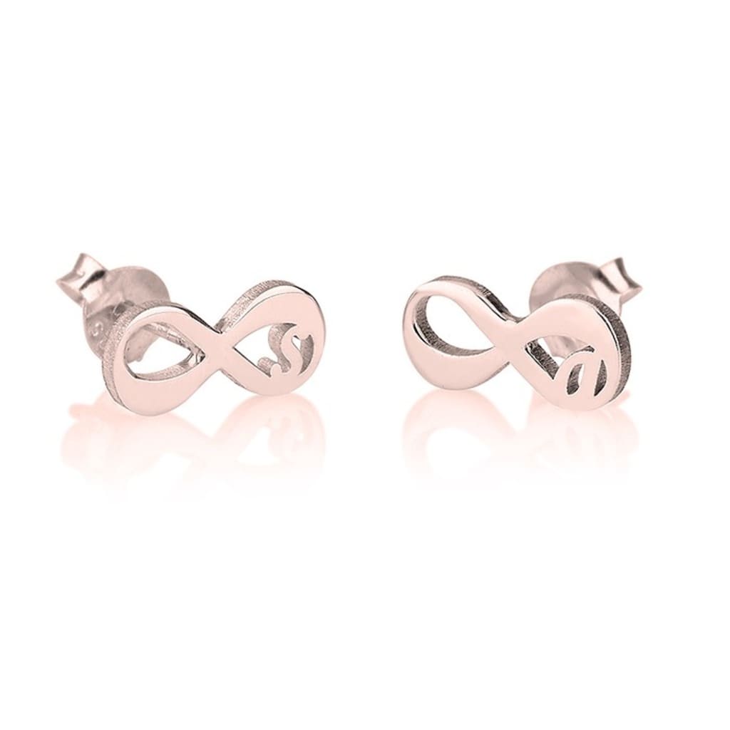 Rose gold infinity symbol earrings on a white background