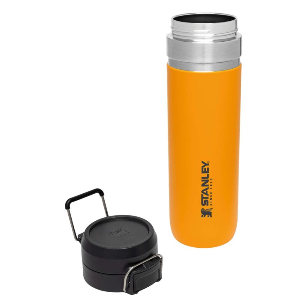 Orange Stanley water bottle with black cap on a white background