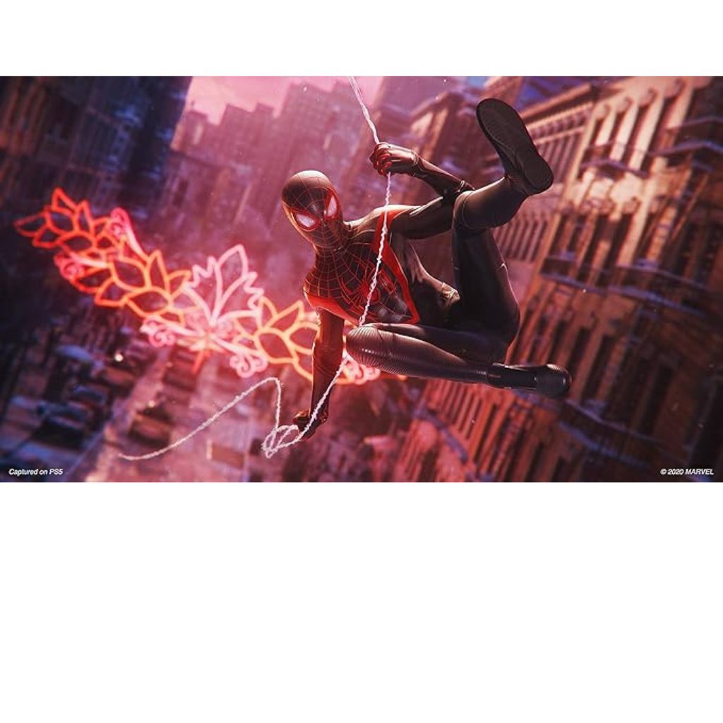 Superhero in a red and black suit swinging on a rope against a cityscape with neon lights.