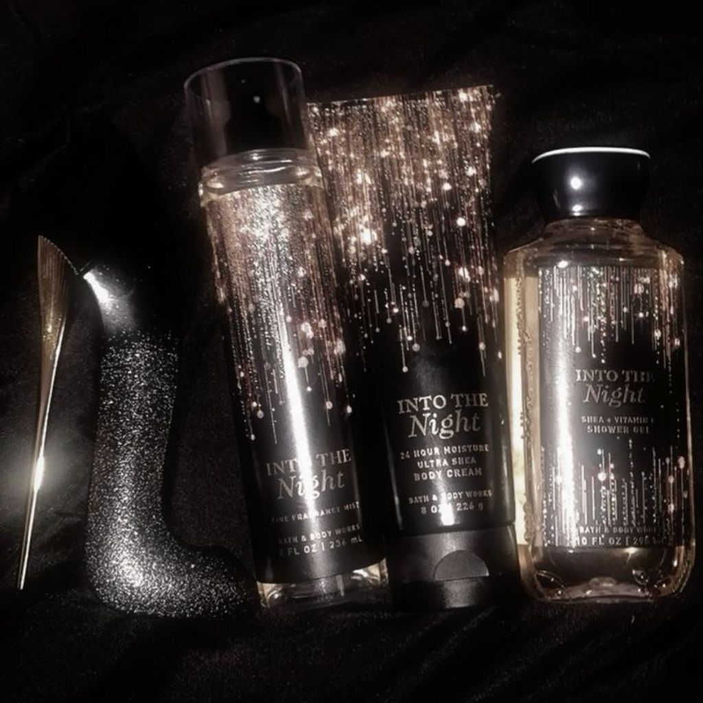 Three 'Into The Night' skincare products on a dark background