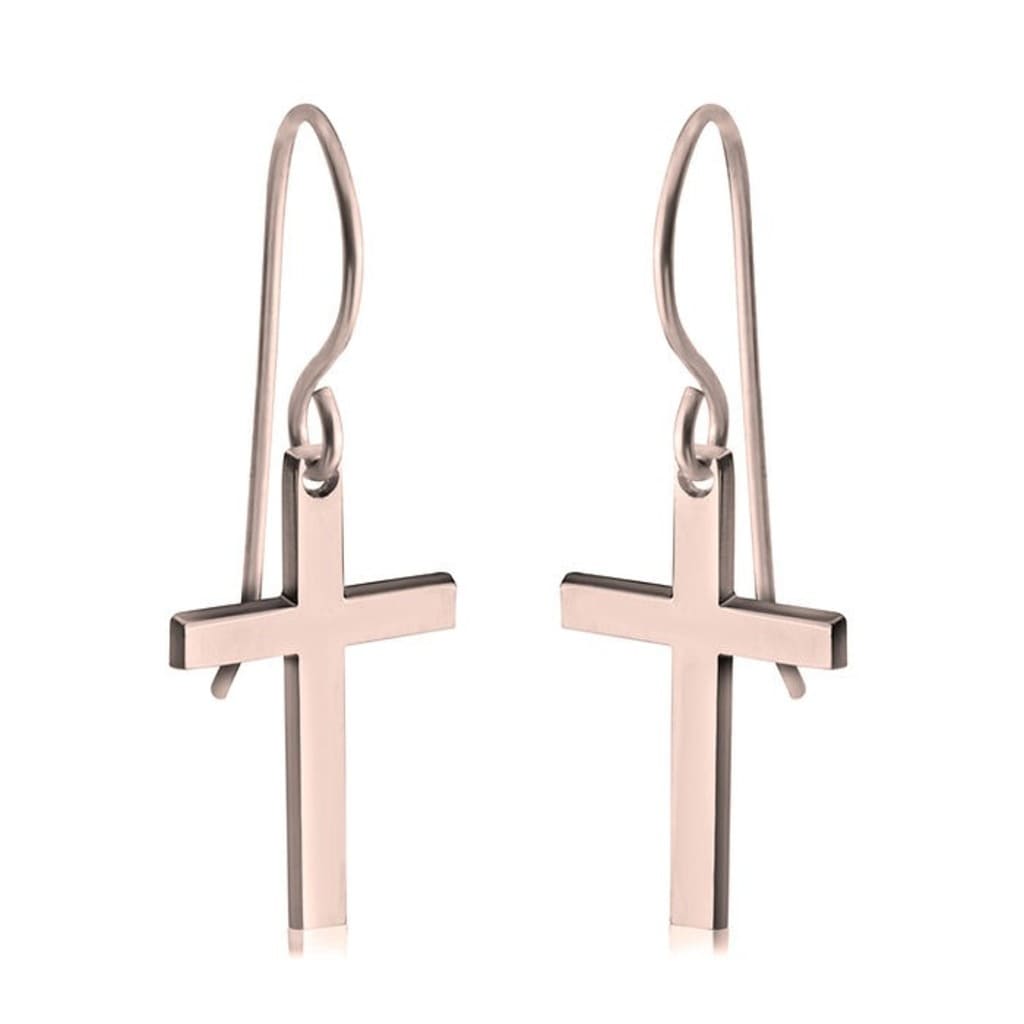 Rose gold cross earrings on a white background