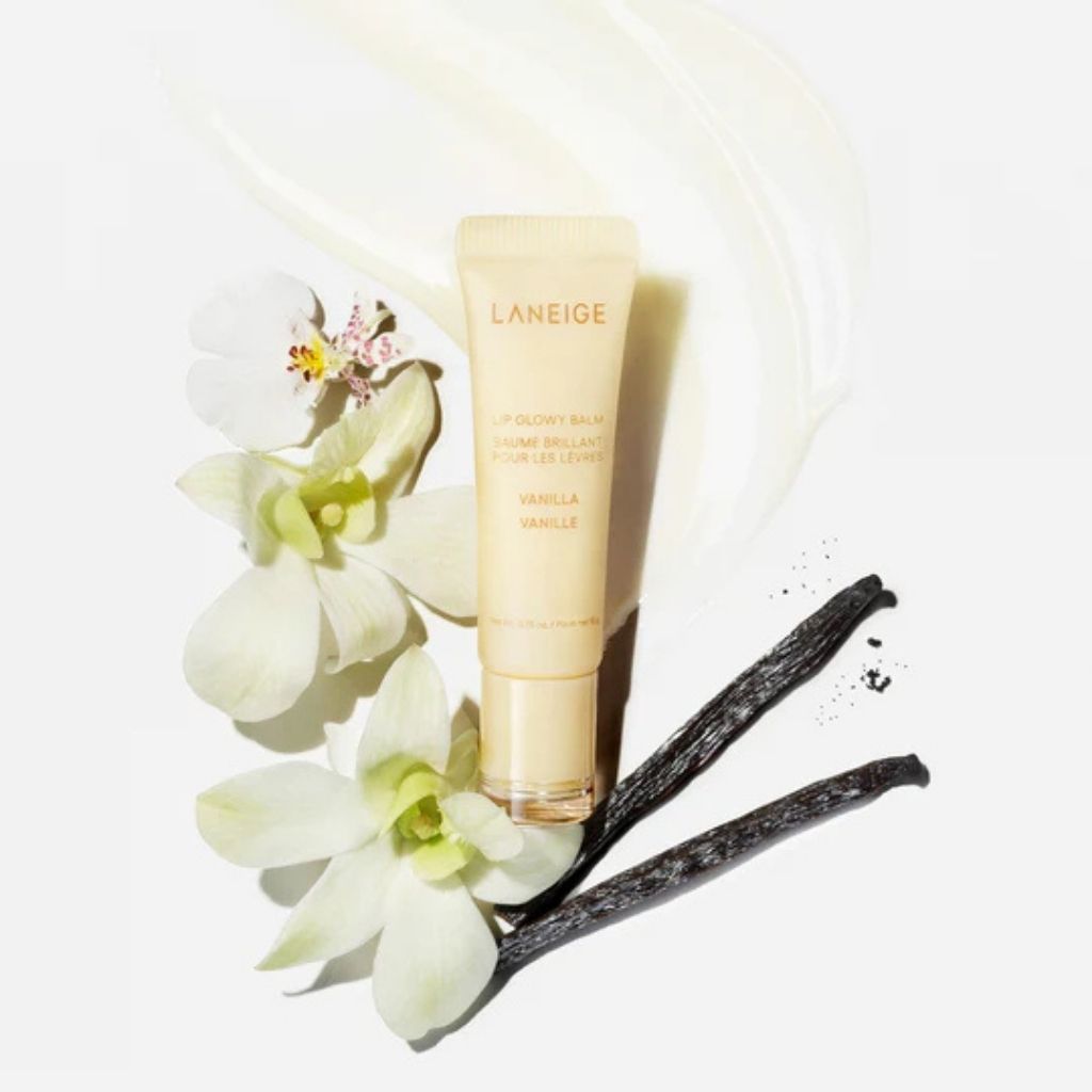Laneige skincare product with vanilla beans and flowers on a light background