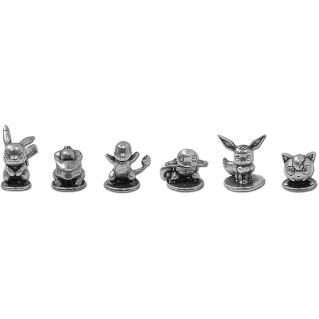 Set of small metallic figurines on a white background