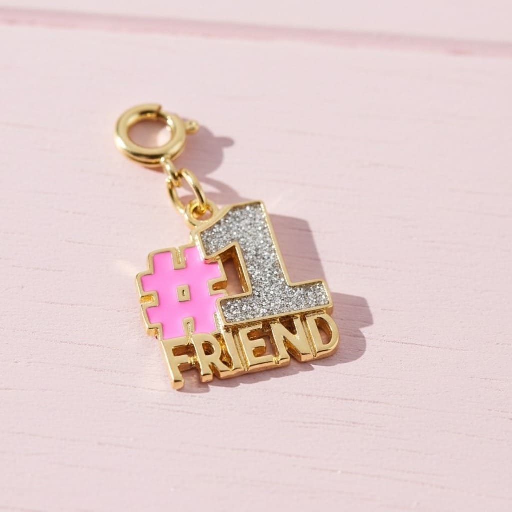 Gold charm with '#1 FRIEND' on a pink background