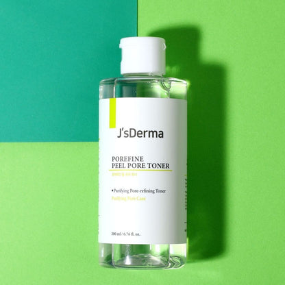 Bottle of J'sDerma pore refining toner on a green and blue background