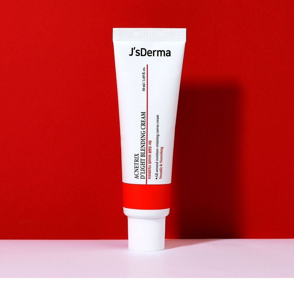 J'sDerma cream tube on a red background
