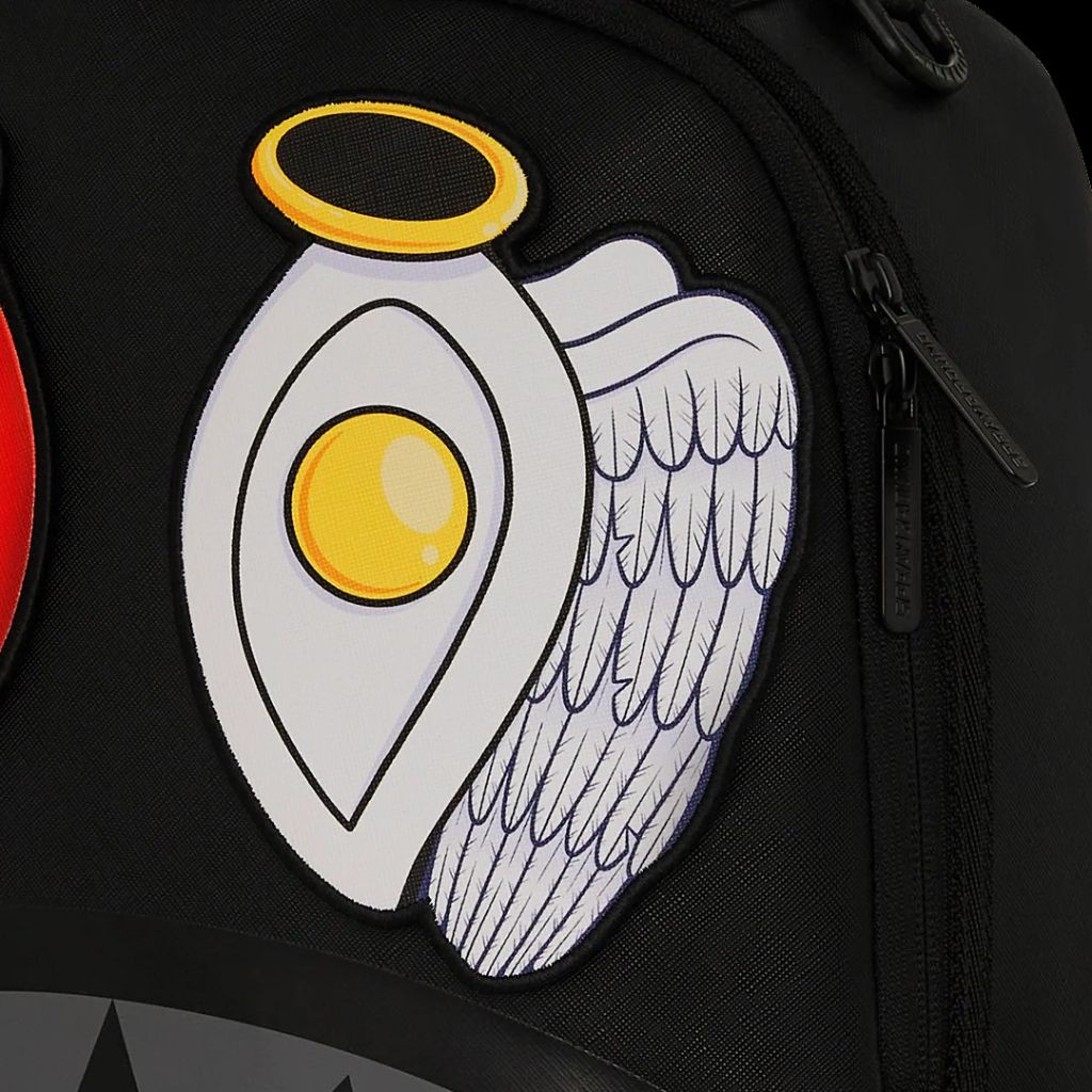Black backpack with a unique design of an egg with wings and a halo on a dark background