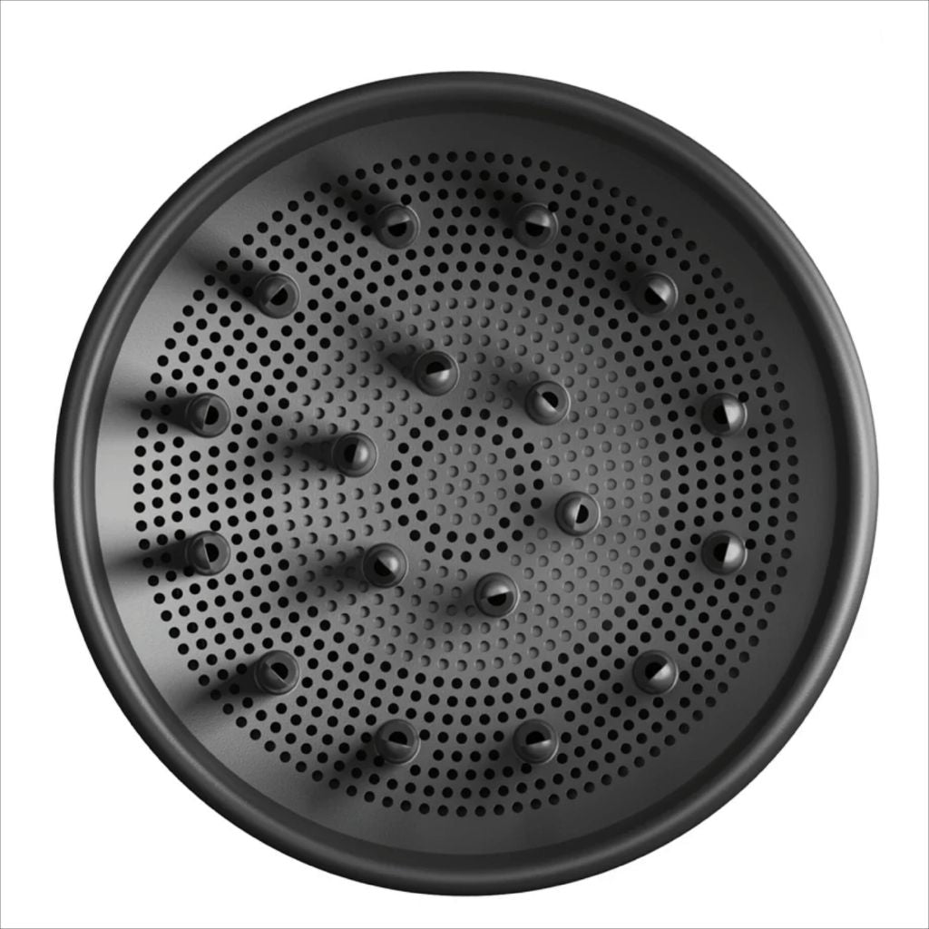 Black perforated round baking tray on a white background