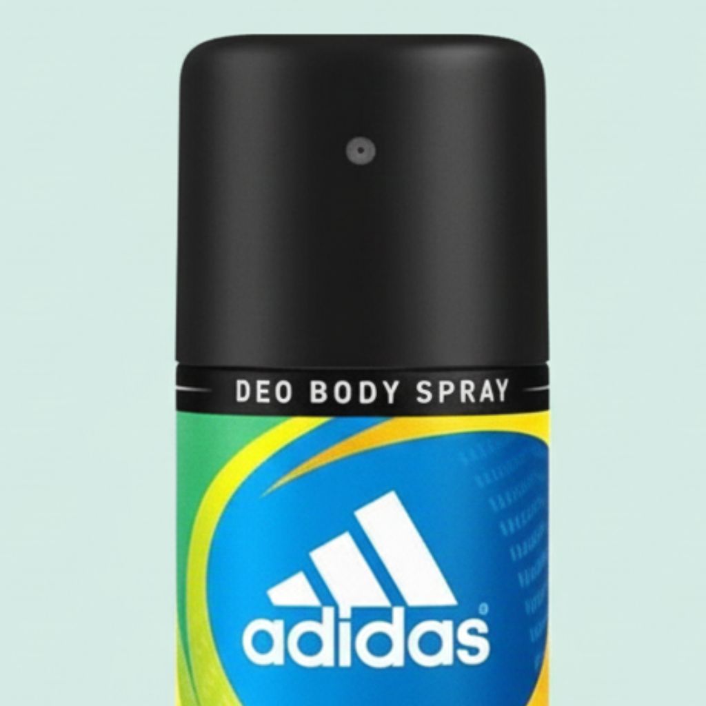 Adidas deodorant spray bottle on a light blue background