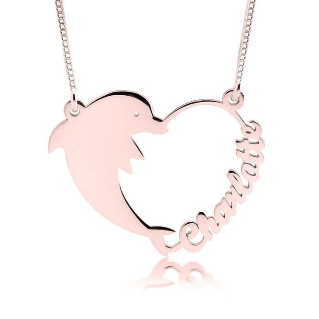 Rose gold dolphin-shaped necklace with 'Mommy' engraved on a white background
