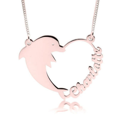 Rose gold dolphin-shaped necklace with 'Mommy' engraved on a white background