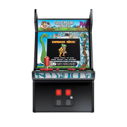 Miniature arcade machine with 'Caveman Ninja' theme on a white background