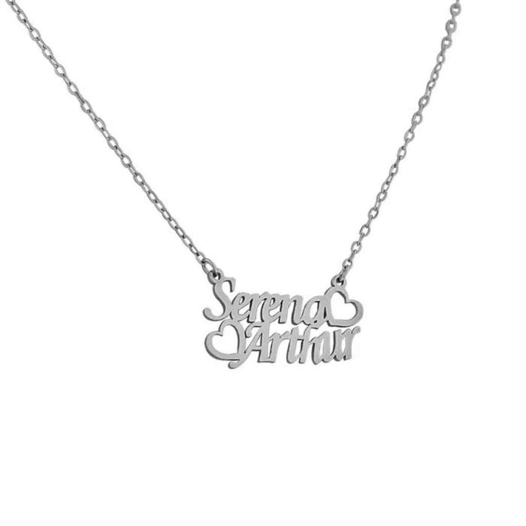 Silver necklace with 'Serena Arthur' pendant on a white background