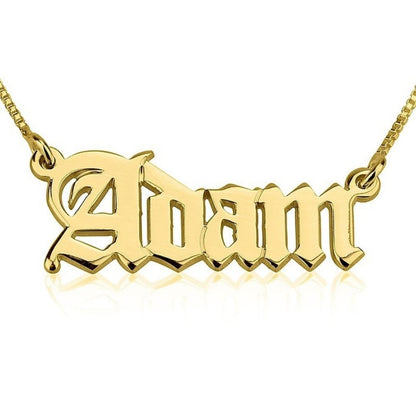 Gold 'Adam' necklace on a white background