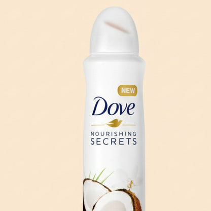 Dove deodorant spray bottle with coconut imagery on a beige background