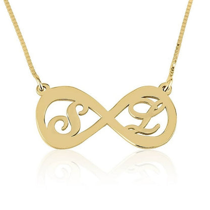 Gold infinity necklace with 'S' and 'L' initials on a white background