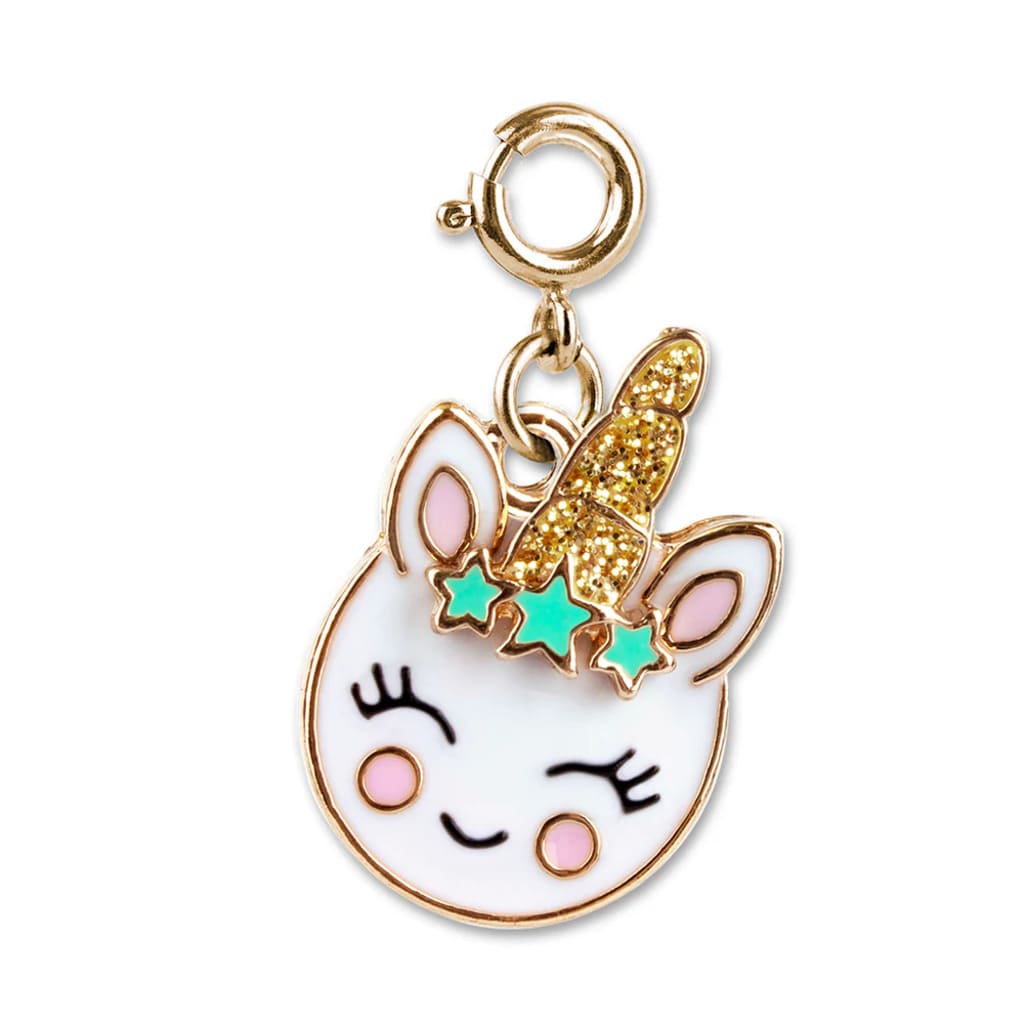 Unicorn-shaped charm with gold glittery horn on a white background