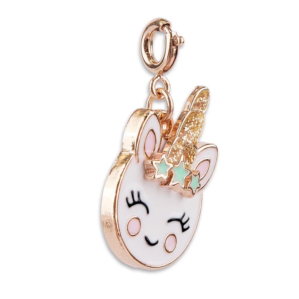 Unicorn-shaped charm with rose gold accents on a white background