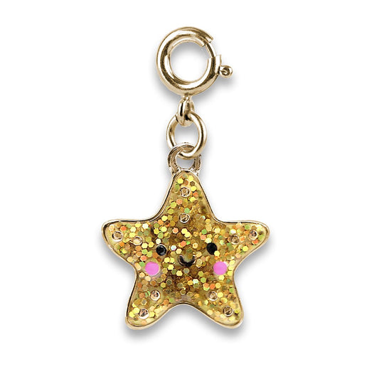 Gold star-shaped charm with glittery finish on a white background