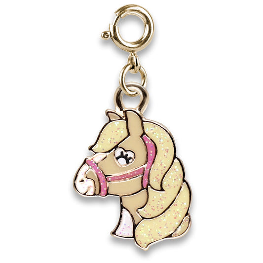 Gold horse charm with pink bridle on a white background
