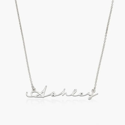 Silver necklace with 'Ashley' script on a white background