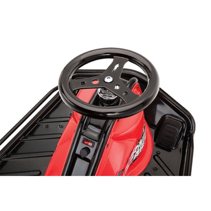 Close-up of a red toy car with a black steering wheel on a white background