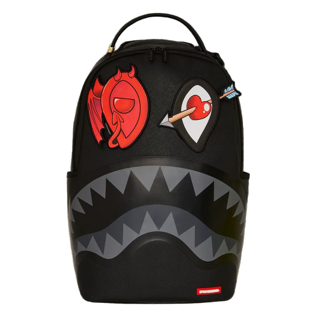 Black backpack with shark design and colorful patches on a white background