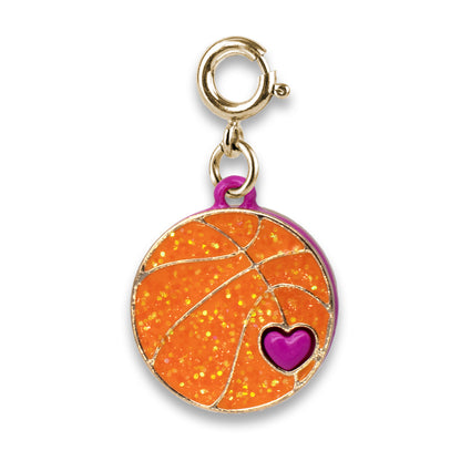 Gold charm with orange glittery surface and purple heart on a white background