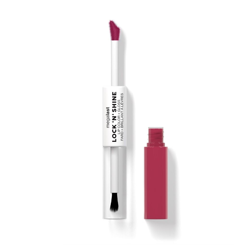 Pink lip gloss with applicator on a white background