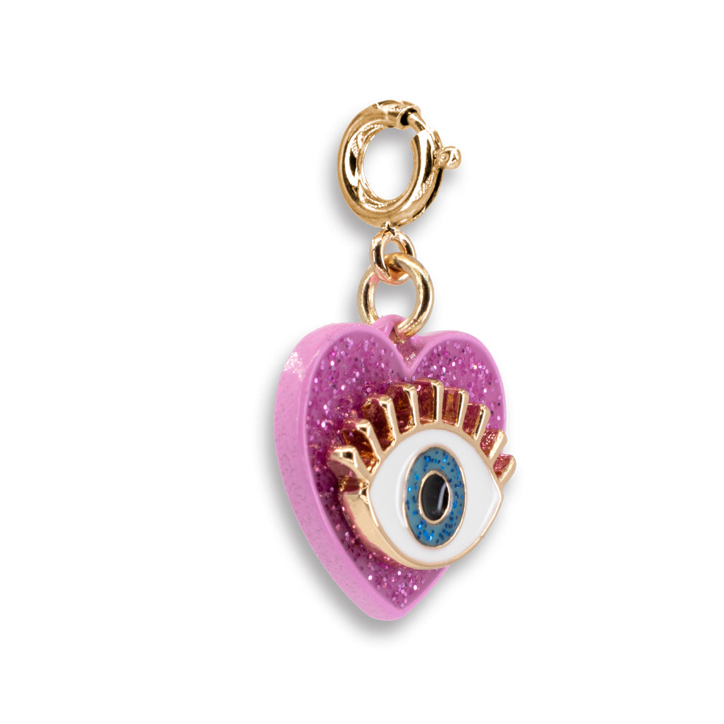 Heart-shaped charm with an eye design on a white background