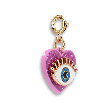 Heart-shaped charm with an eye design on a white background
