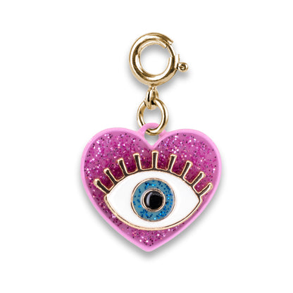 Pink glittery heart charm with an eye design on a gold chain against a white background