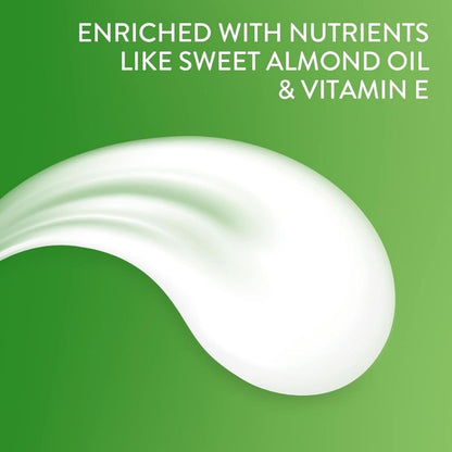 White cream or lotion with a green background and text about ingredients.