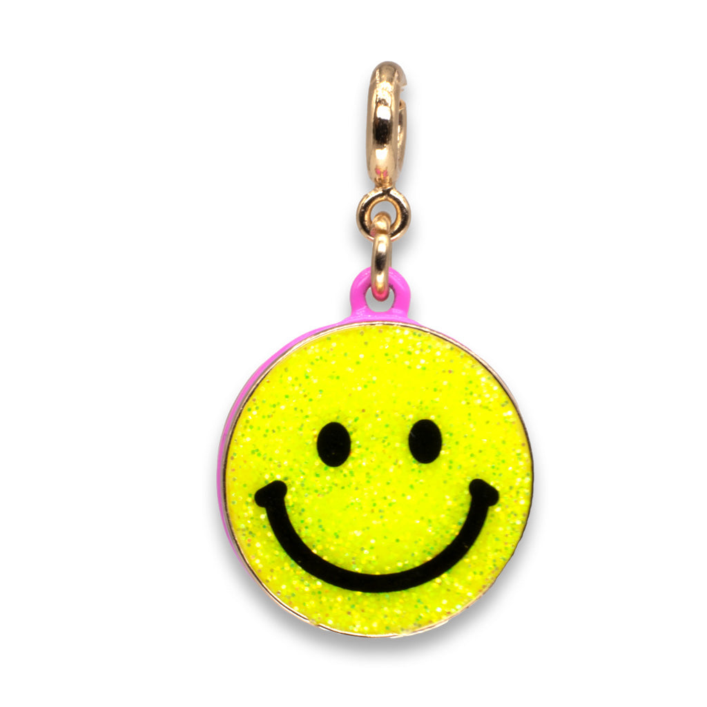 Yellow smiley face charm with gold and pink accents on a white background