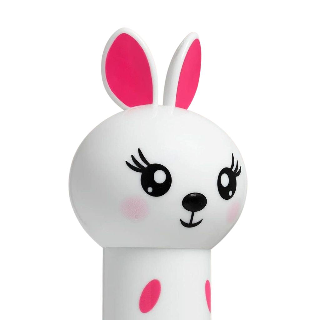 White toy with pink ears and polka dots on a white background