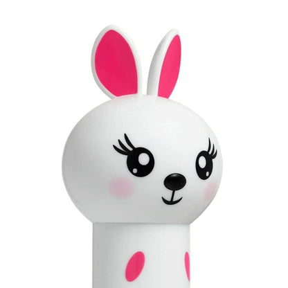 White toy with pink ears and polka dots on a white background