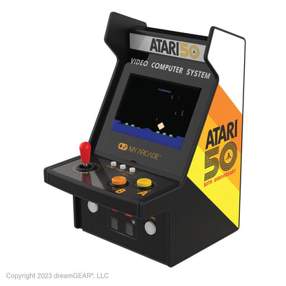 Miniature Atari video computer system with 50th anniversary branding on a white background