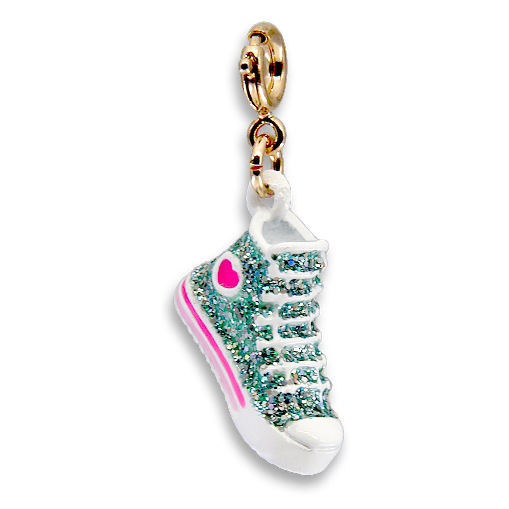 Sneaker-shaped charm with gold top on a white background