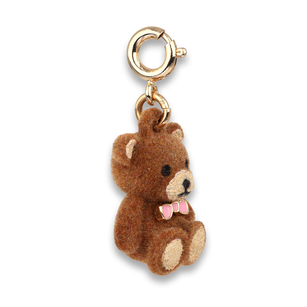 Brown teddy bear charm with a pink bow tie on a white background
