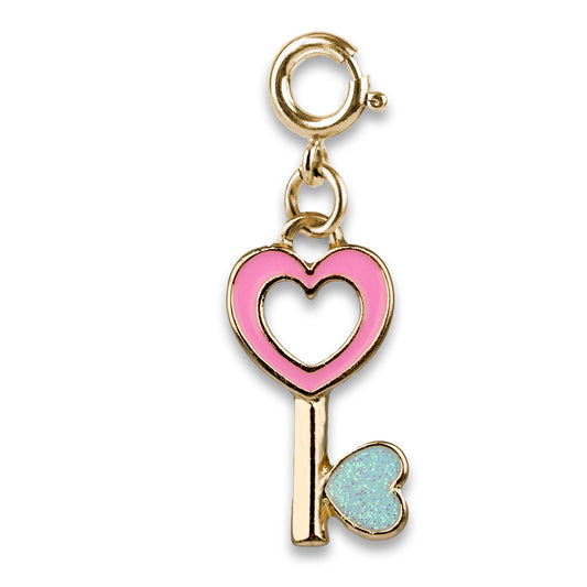Gold charm with pink heart and blue heart key on a white background