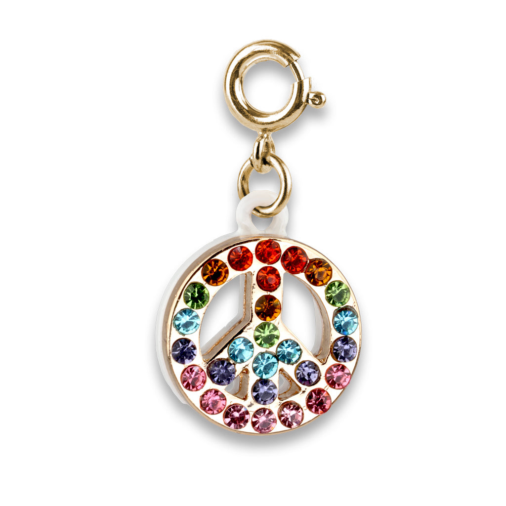 Gold peace symbol charm with colorful crystals on a white background