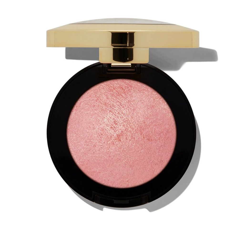 Compact blush with a gold lid on a white background