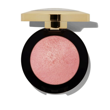 Compact blush with a gold lid on a white background